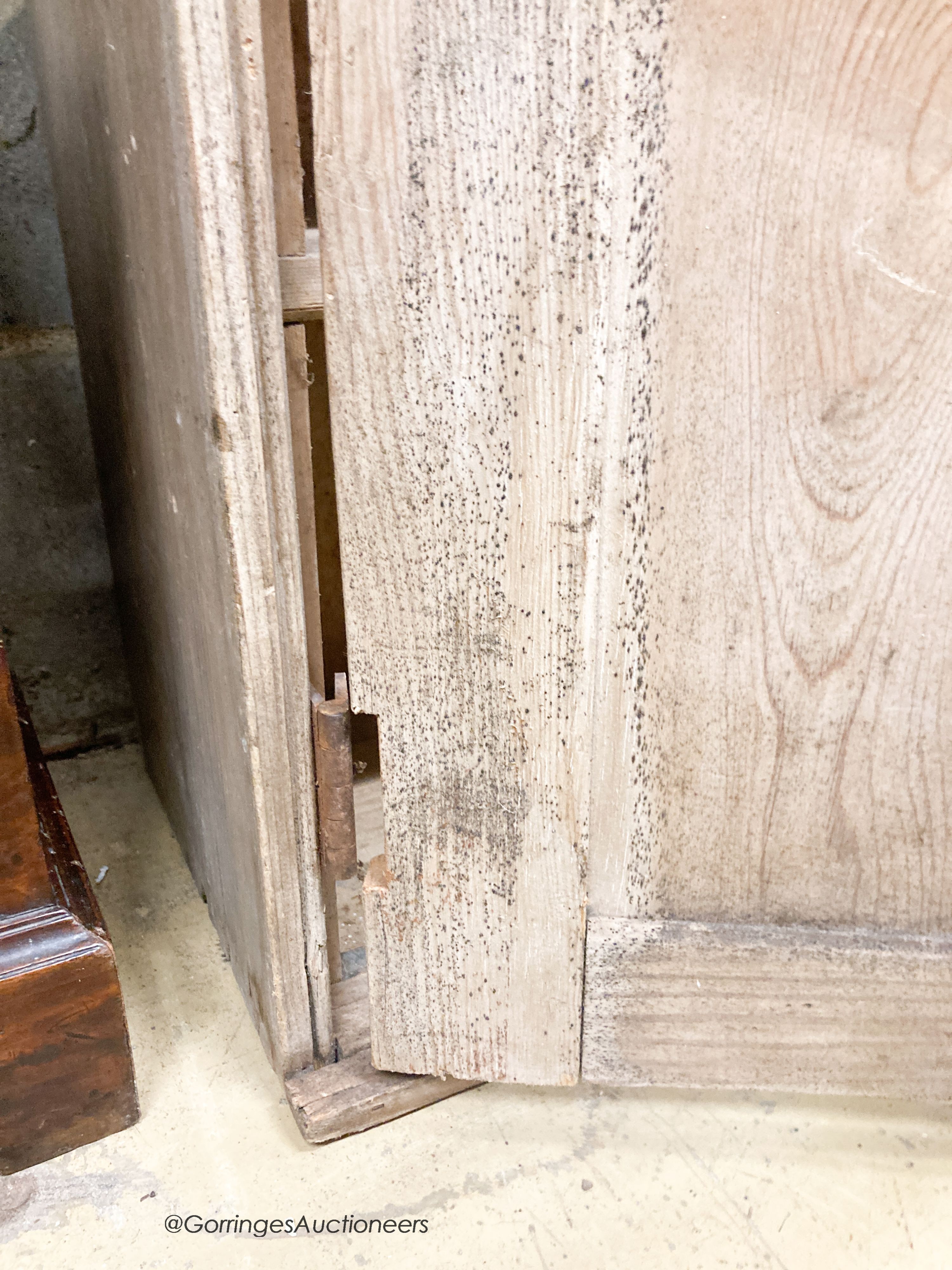 A Victorian pine two door low cupboard, width 122cm, depth 32cm